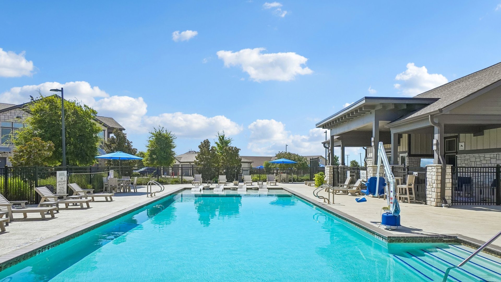 Springs at McKinney pool with lounge seating - McKinney, TX