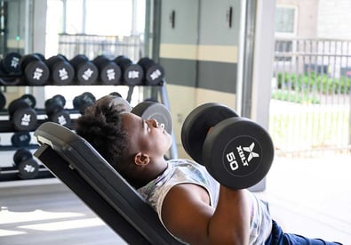 lifting weights in fitness center