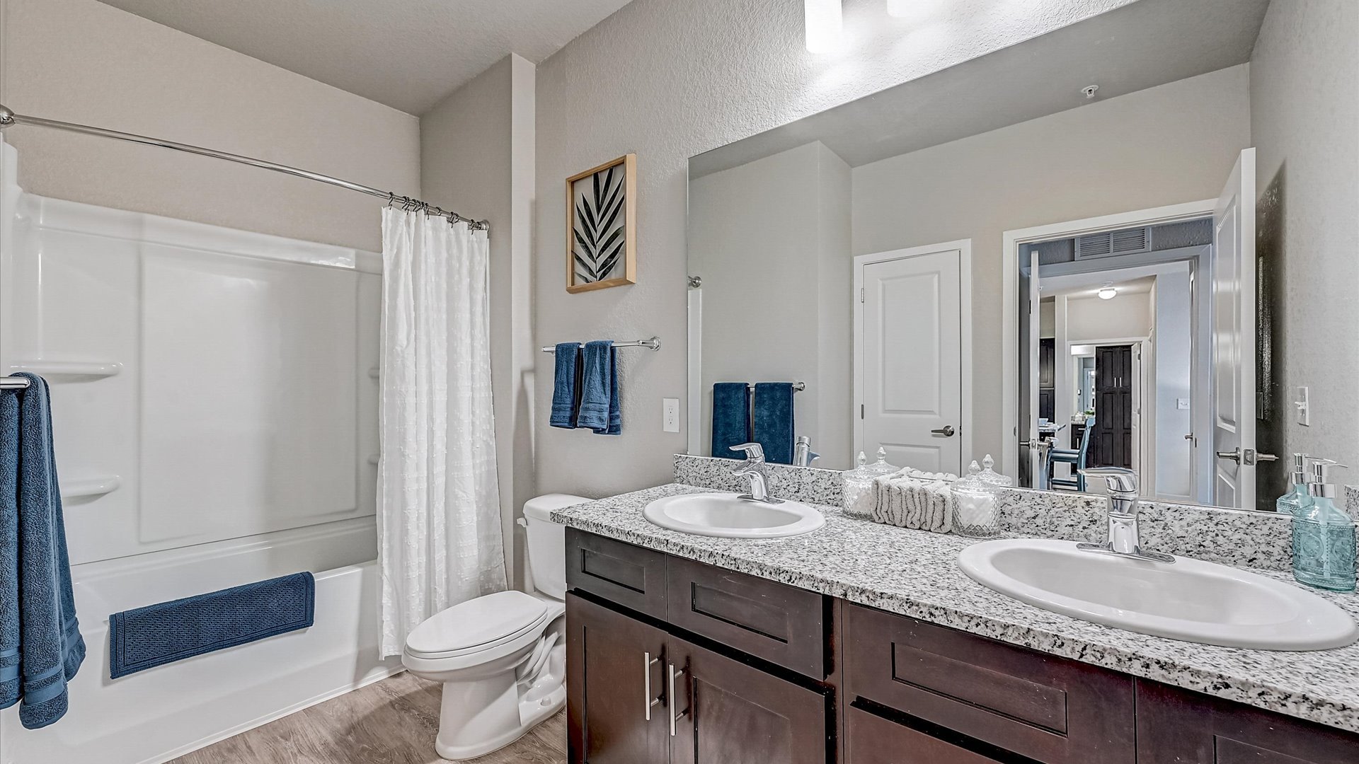 Spacious bathroom with garden tub, granite counters, mirror and expresso cabinets Springs at Flagler Center Apartments in Jacksonville, FL