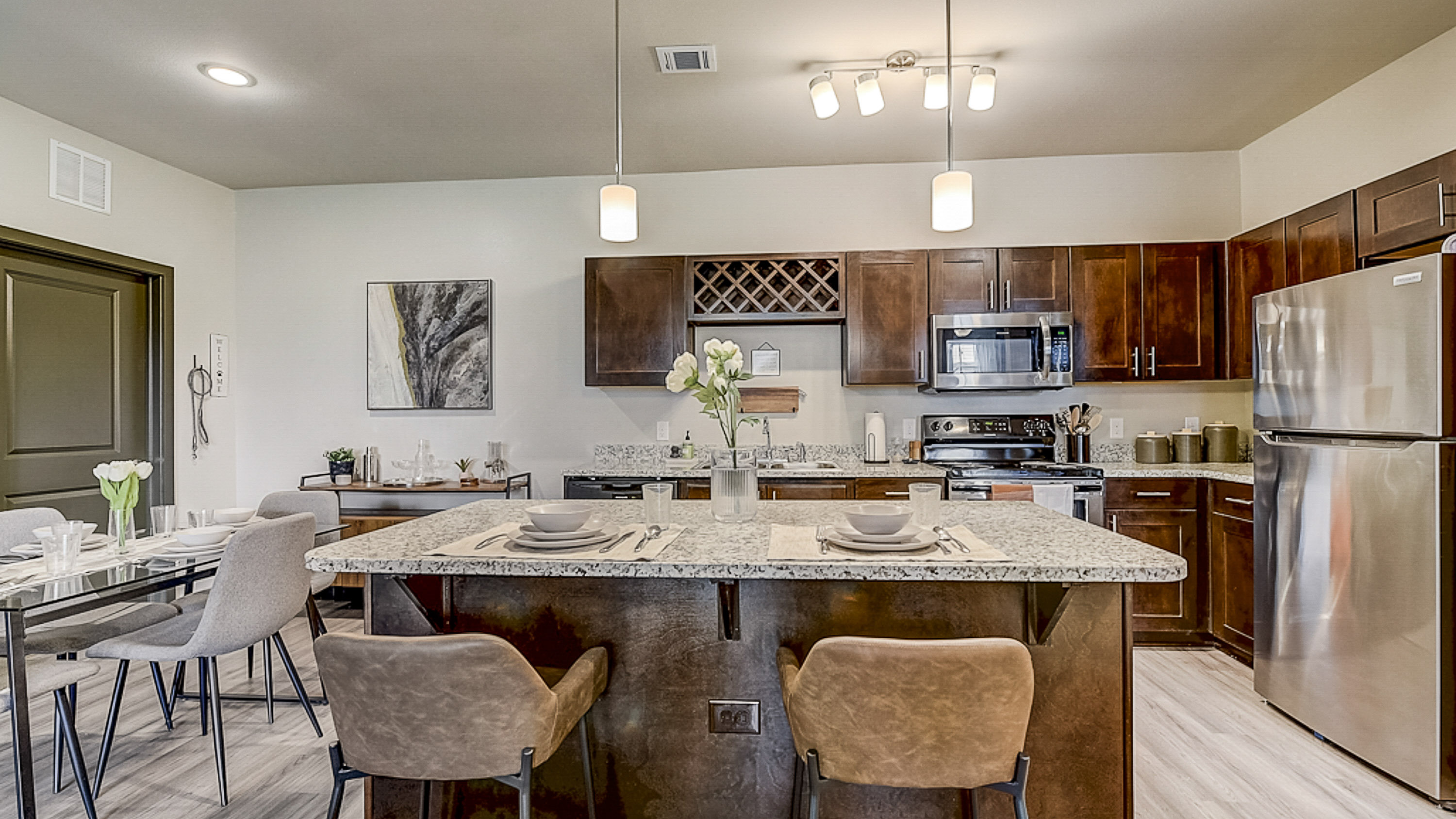 Luxurious premium finishes and huge island in the kitchen at Springs at Grand Prairie apartments-27