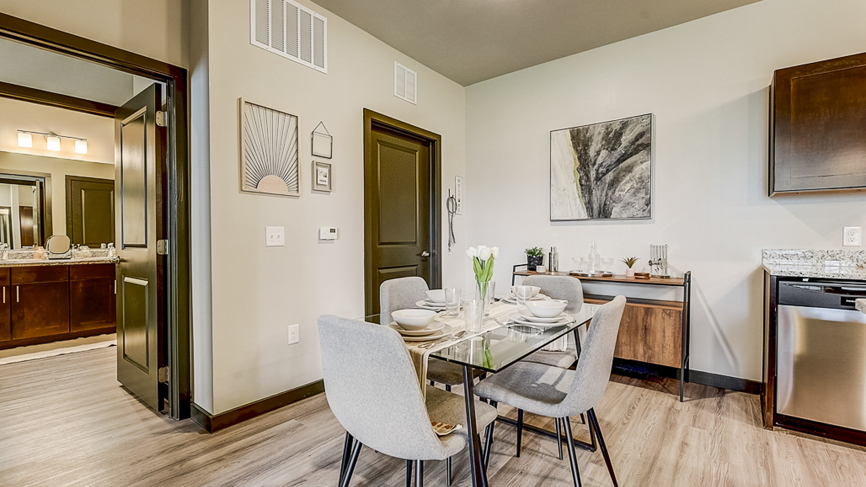 Washer and Dryer included, Dining Area, and Entry into the guest bathroom at Springs at Grand Prairie apartments-33