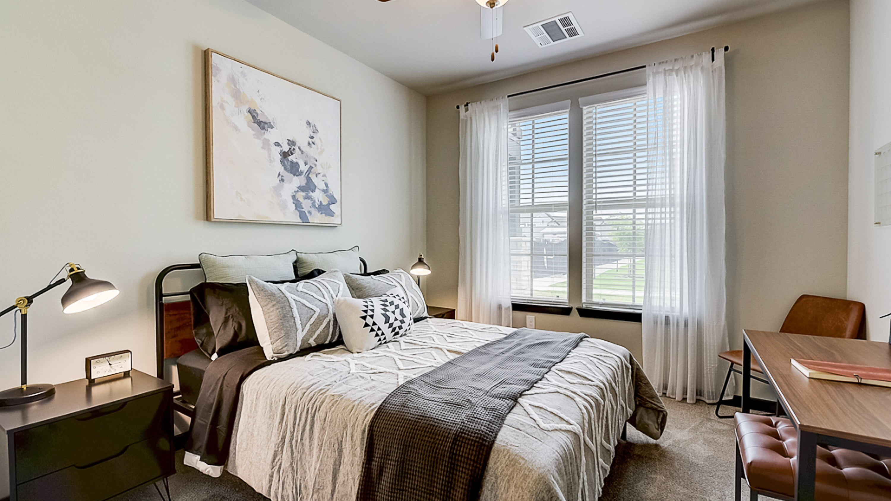 Primary Bedroom with lots of big windows and natural light at Springs at Grand Prairie apartments-44
