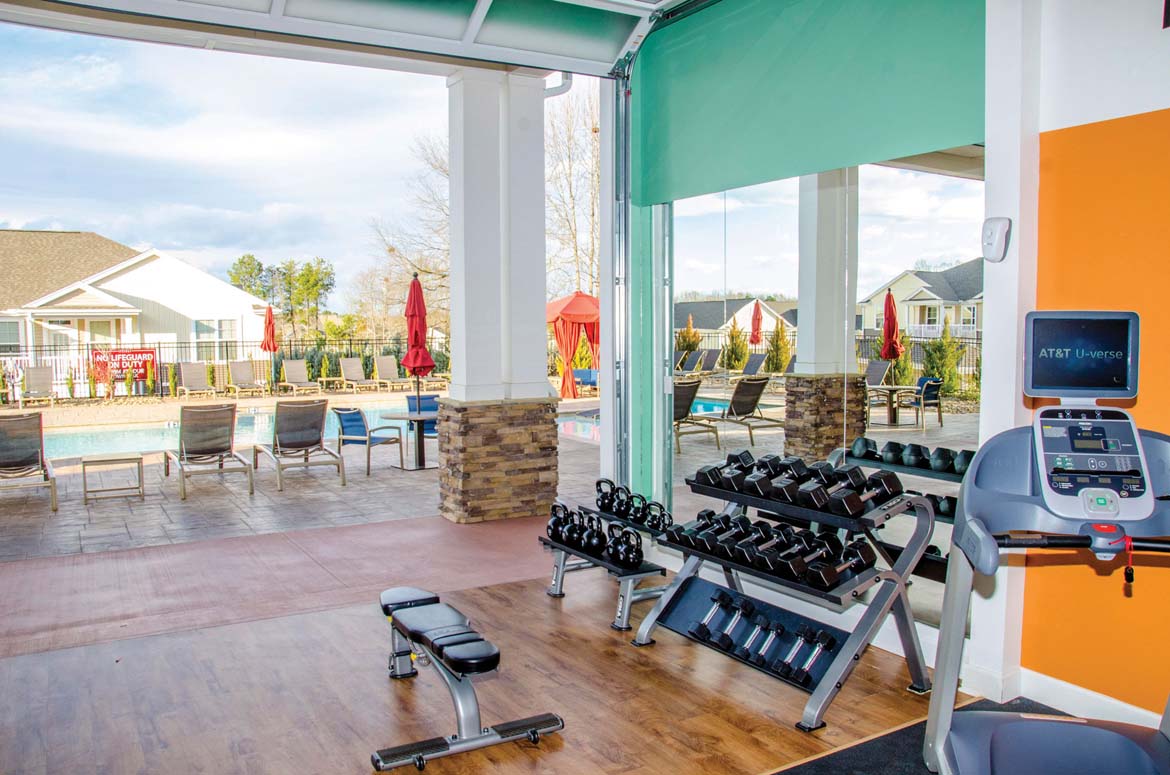 Workout room with free weights at a luxury apartment