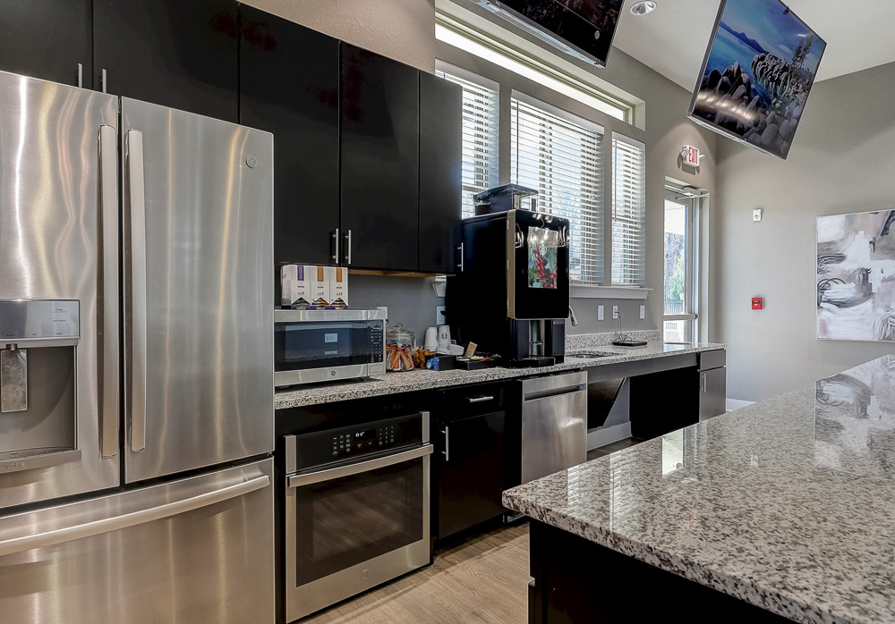 Free coffee bar and kitchenette in the Clubhouse at Springs at Newnan Apartments in Georgia-20