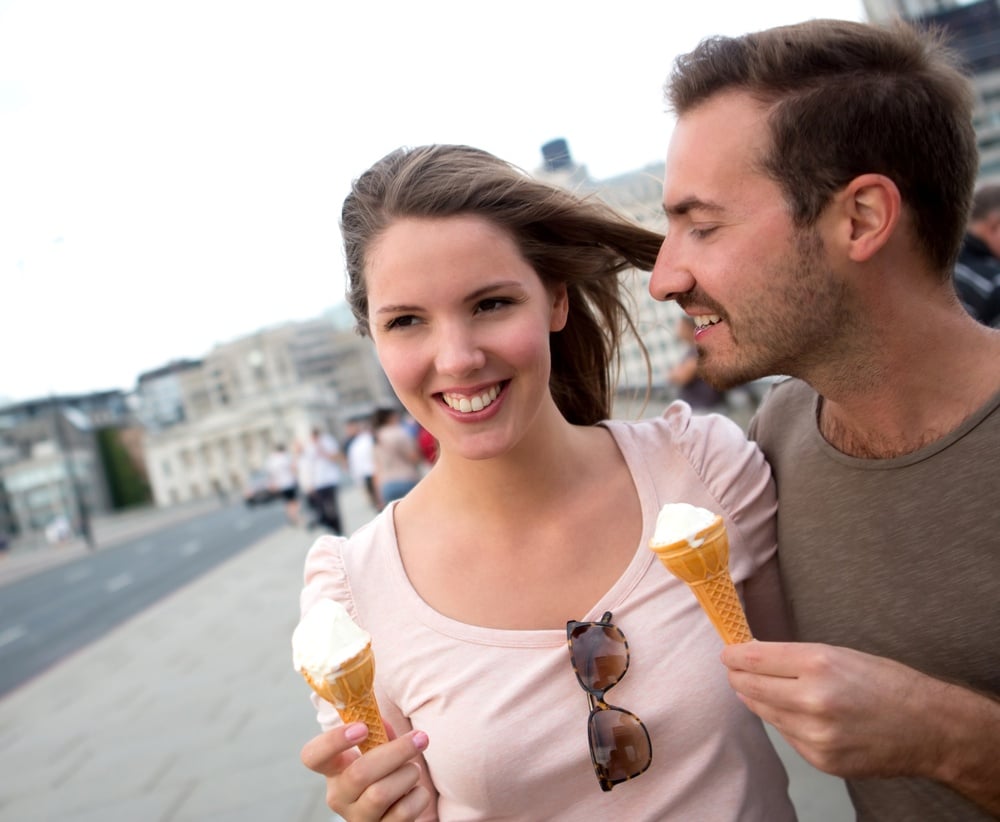 Romantic couple enjoying an ice cream outdoors.jpeg
