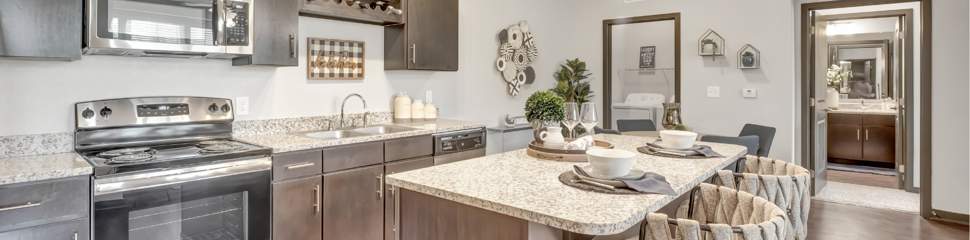 Luxury kitchen at Springs at La Grange featuring granite counter tops and premium finishes.